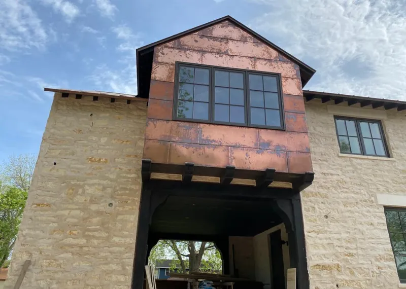 Copper metal panel facade on a stone building for Skylight Installation in Los Angeles